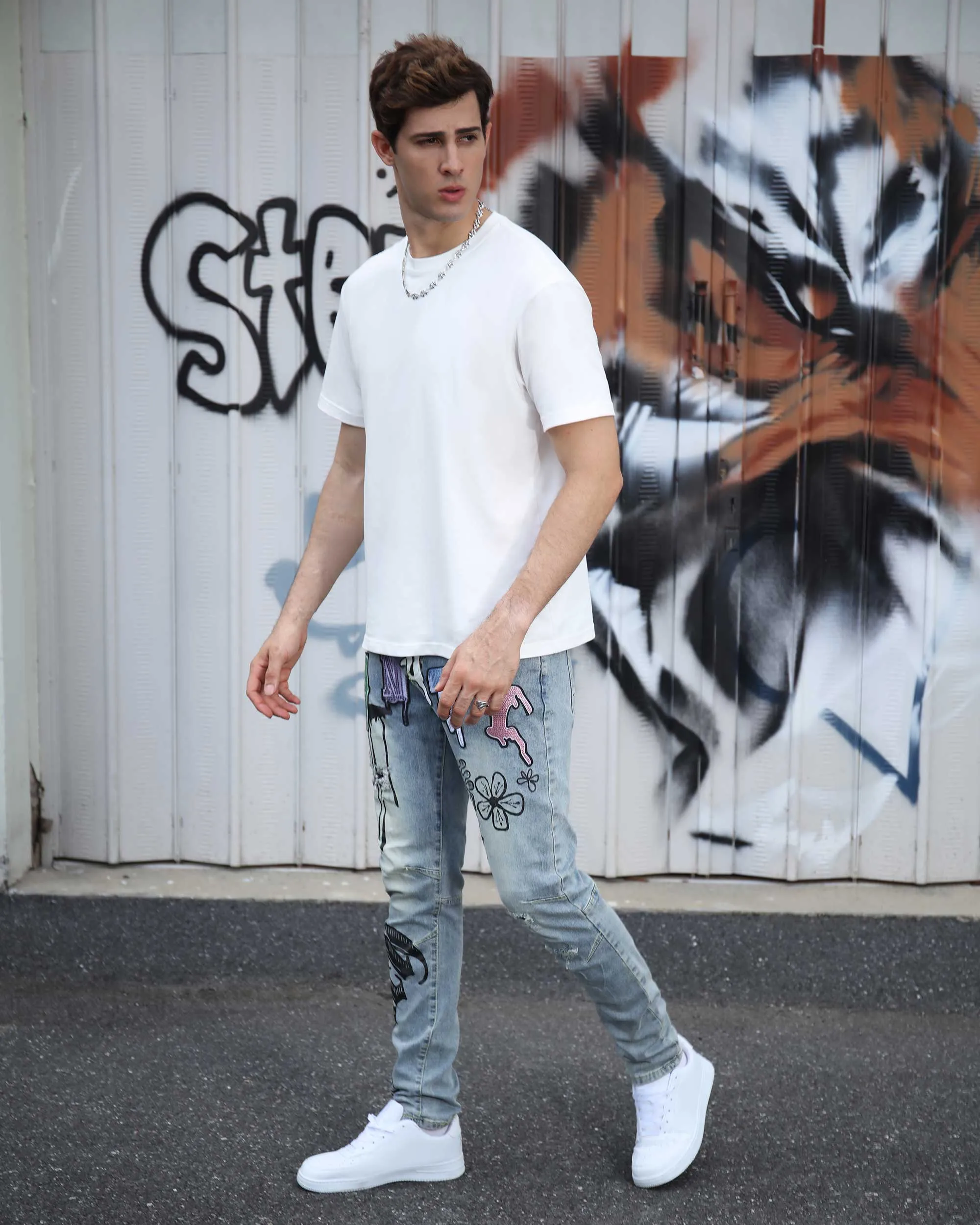 Street Art Light Wash Blue Jeans Adorned with Painted Graffiti