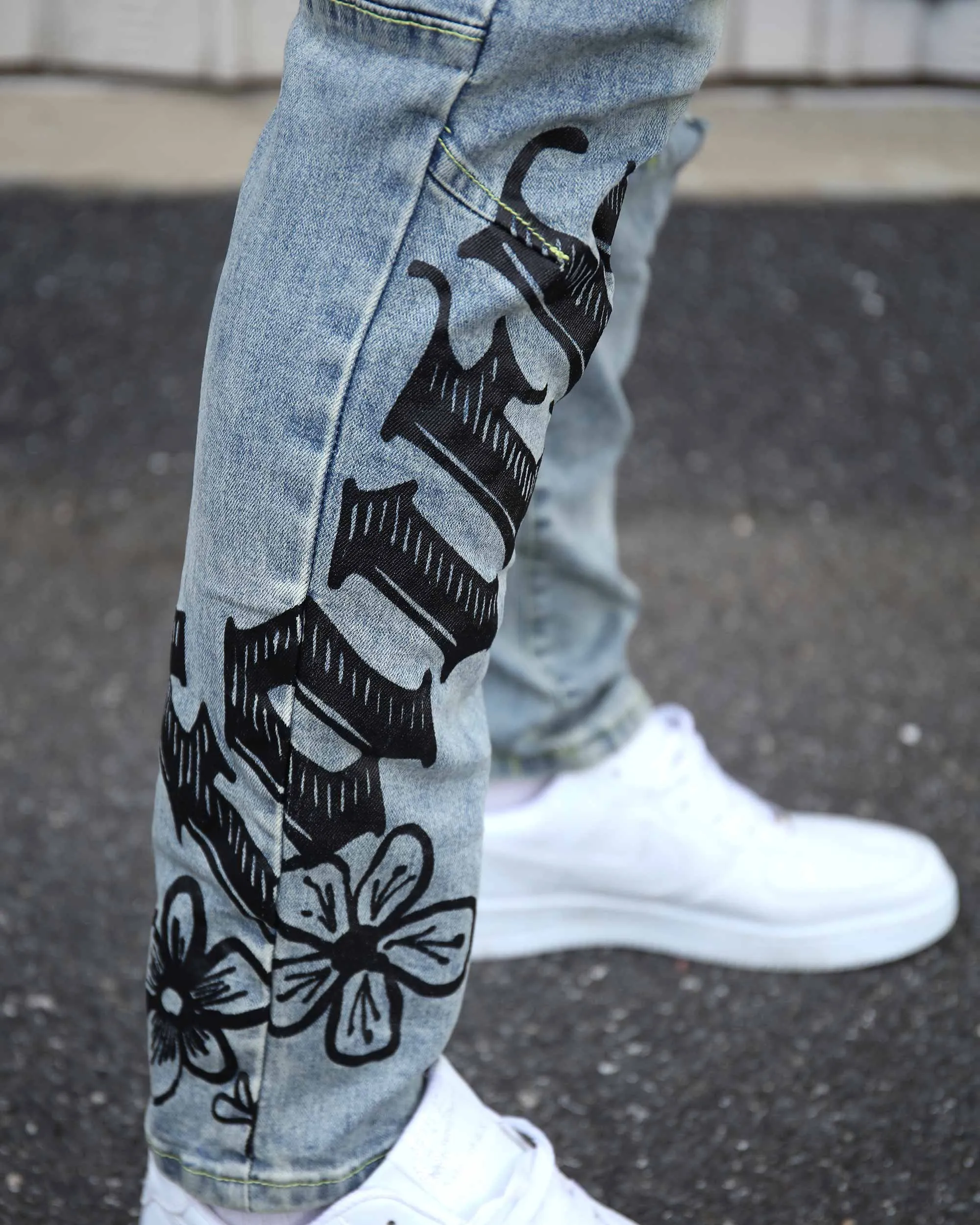 Street Art Light Wash Blue Jeans Adorned with Painted Graffiti